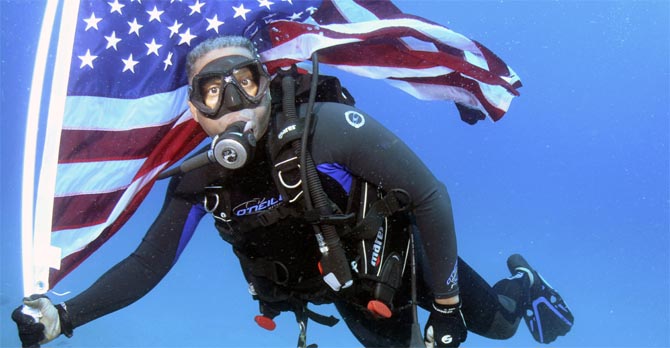 US Congressman takes heat for diving with US flag